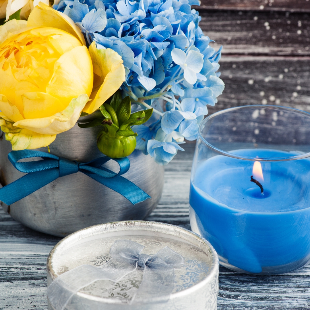 yellow and blue flower arrangement on table